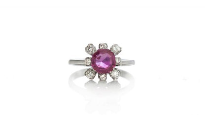 Vintage 1ct Burmese Ruby and Diamond Floral Cluster Ring; set with a natural 1.00 carat octagonal-cut Burmese ruby surrounded by 0.48cts round brilliant-cut diamonds. Circa 1950s-1970s, with Certificate