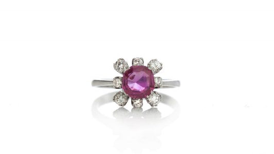 Vintage 1ct Burmese Ruby and Diamond Floral Cluster Ring; set with a natural 1.00 carat octagonal-cut Burmese ruby surrounded by 0.48cts round brilliant-cut diamonds. Circa 1950s-1970s, with Certificate