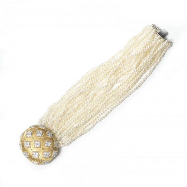 Contemporary Multi Row Pearl Bracelet with Diamond set 18ct Gold Clasp; oval gold clasp decorated with quatrefoils of 2.75cts round brilliant cut diamonds, on a cultured seed pearl bracelet comprising of twenty-one rows. Length 190mm