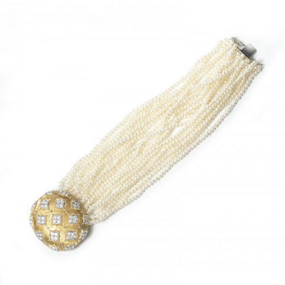 Contemporary Multi Row Pearl Bracelet with Diamond set 18ct Gold Clasp; oval gold clasp decorated with quatrefoils of 2.75cts round brilliant cut diamonds, on a cultured seed pearl bracelet comprising of twenty-one rows. Length 190mm