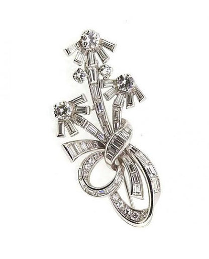 Vintage 1950's Diamond Floral Spray Brooch, 3.50cts, in Platinum; An unusual vintage diamond floral brooch set with baguette and brilliant-cut diamonds.