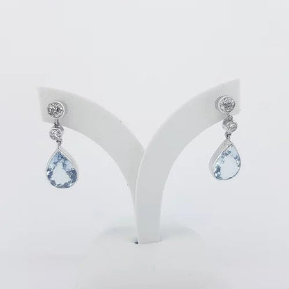 Pear Shaped Aquamarine and Diamond Drop Earrings; 4.00cts pear-cut aquamarines suspended from 0.66cts graduated brilliant-cut diamonds, in 18ct white gold