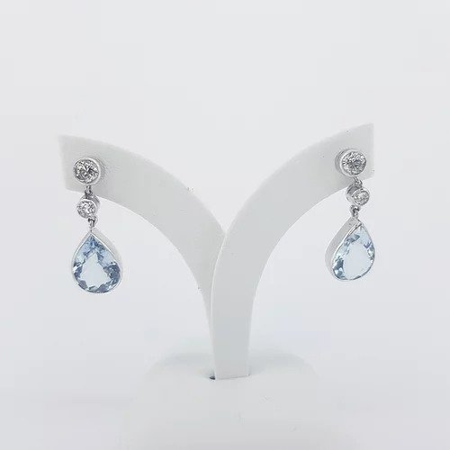 Pear Shaped Aquamarine and Diamond Drop Earrings; 4.00cts pear-cut aquamarines suspended from 0.66cts graduated brilliant-cut diamonds, in 18ct white gold