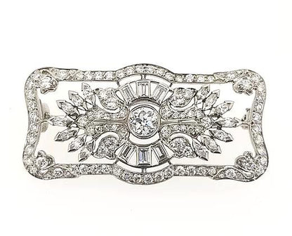 Art Deco 2.00ct Diamond Brooch in Platinum; central diamond surrounded by round, baguette, and marquise-cut diamonds, set in a geometric floral design