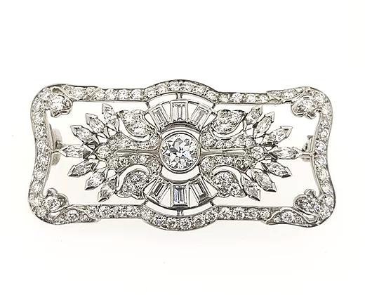 Art Deco 2.00ct Diamond Brooch in Platinum; central diamond surrounded by round, baguette, and marquise-cut diamonds, set in a geometric floral design