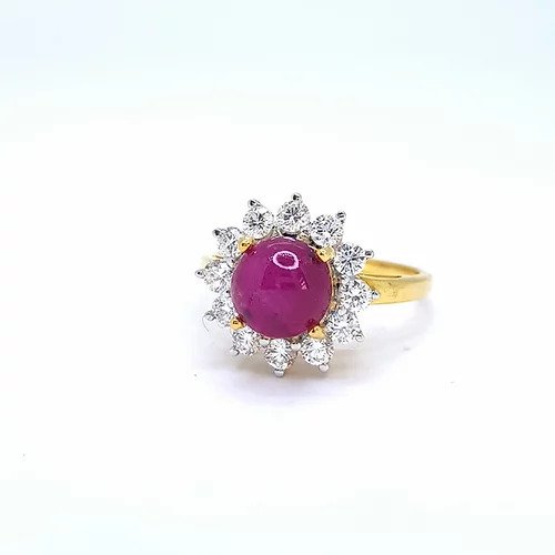 Cabochon Burma Ruby and Diamond Cluster Ring; central round cabochon Burmese ruby surrounded by sparkling diamonds, in 18ct yellow gold