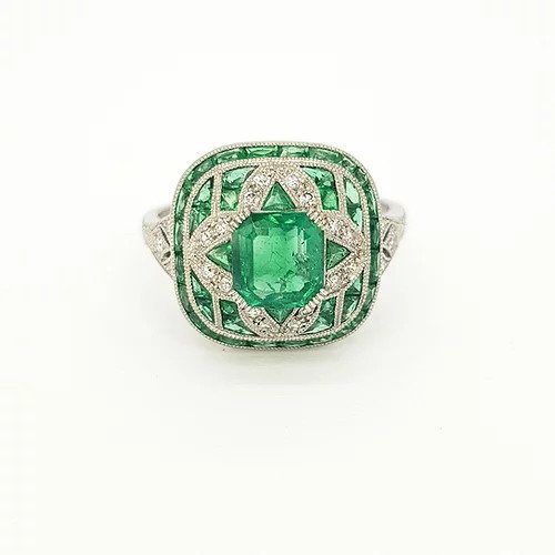 Colombian Emerald and Diamond Cocktail Ring, Art Deco style, mixed cut emeralds and diamonds arranged in a geometric floral design. Mounted in platinum