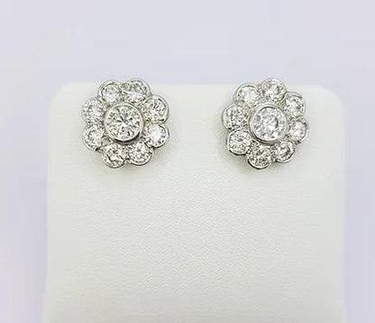Diamond Daisy Cluster Stud Earrings, 2.55 carat total, rub-over setting, mounted in 18ct white gold, with post and butterfly fittings.