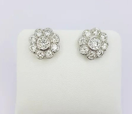Diamond Daisy Cluster Stud Earrings, 2.55 carat total, rub-over setting, mounted in 18ct white gold, with post and butterfly fittings.
