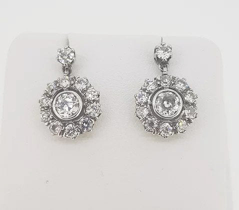 Old Cut Diamond Cluster Drop Earrings; central old-cut diamond with a diamond surround, suspended from a diamond set stud, 2.50 carat total