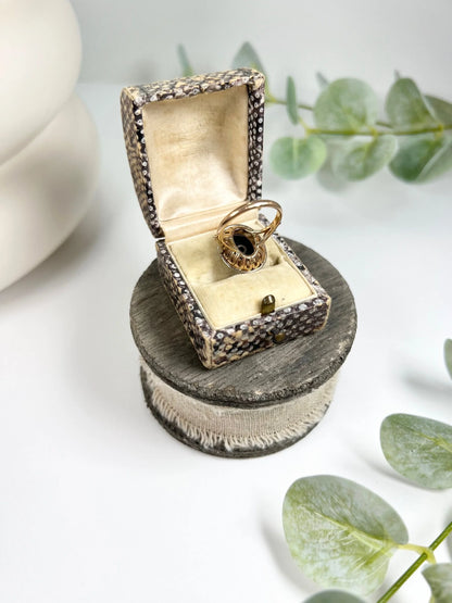 Art Deco 18 Carat Two Colour Gold Oval Onyx and Diamond Halo Ring, Circa 1920