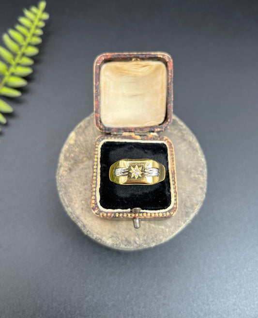 A yellow and white gold diamond set signet ring, in a box