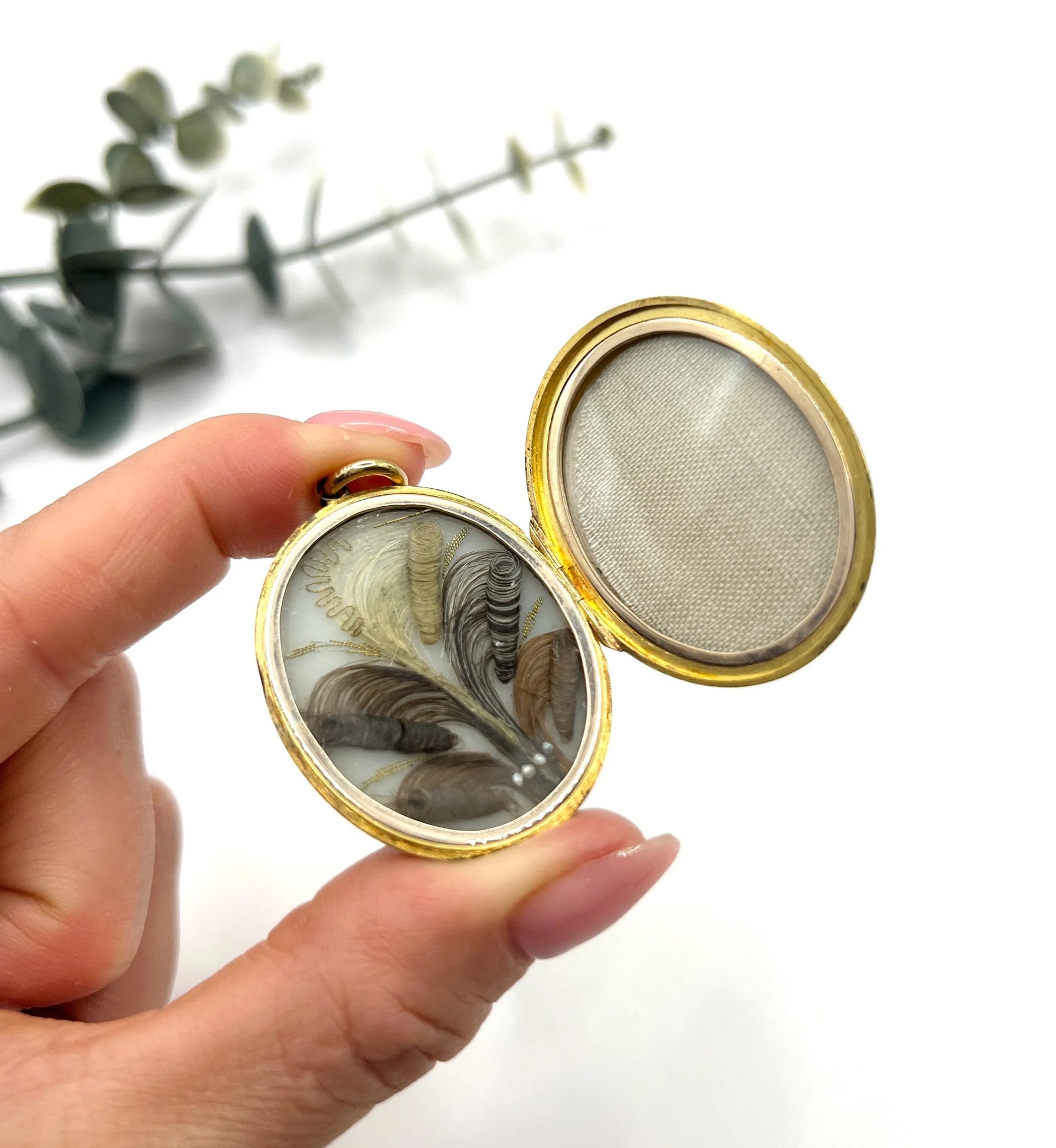 Early Victorian 15 Carat Yellow Gold Floral Engraved Oval Shaped Locket, Circa 1860