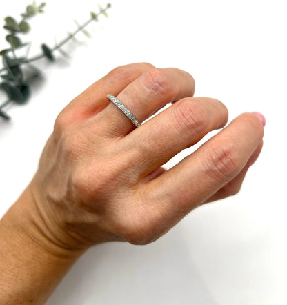 A platinum and diamond full eternity band ring, modelled on a hand