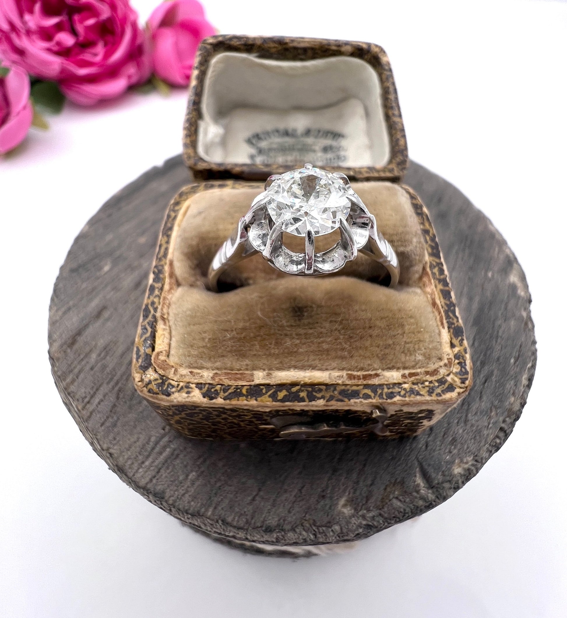 A solitaire diamond ring in platinum, in an antique ring box