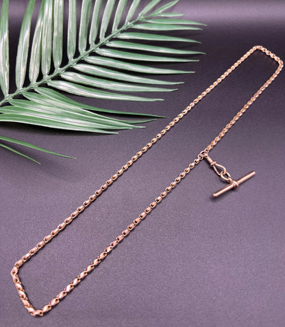 A rose gold tulip link chain necklace with a dog clip clasp and T-bar