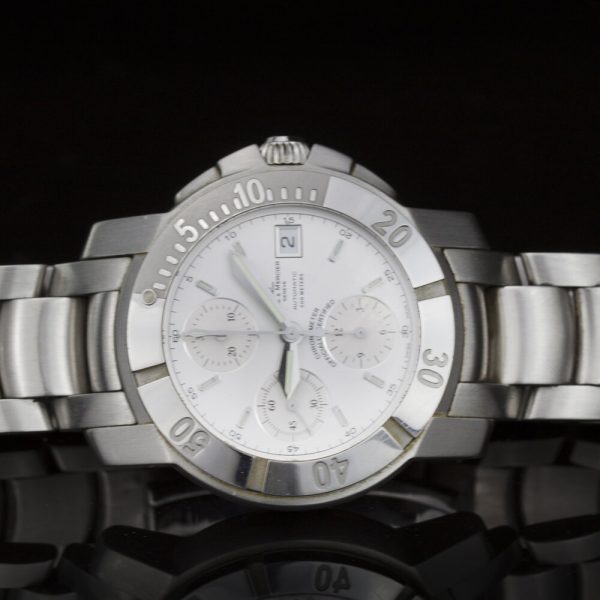 Baume and Mercier Capeland 44mm Stainless Steel Automatic Chronograph Watch, white dial, fluorescent hands and baton hour markers, stainless steel bracelet strap