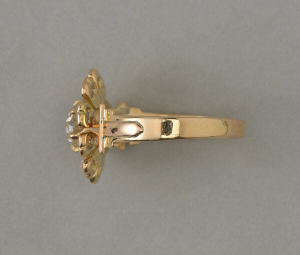 Antique Edwardian Old Cut Diamond Flower Ring; central 0.67ct old cut diamond, rose-cut diamond set petals, 1.07 carat total, 18ct yellow gold, France, circa 1910