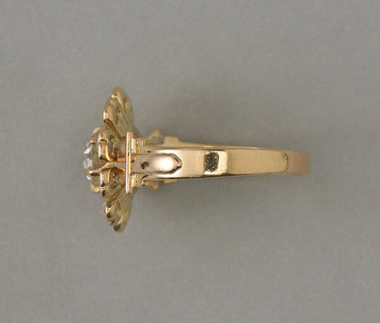 Antique Edwardian Old Cut Diamond Flower Ring; central 0.67ct old cut diamond, rose-cut diamond set petals, 1.07 carat total, 18ct yellow gold, France, circa 1910