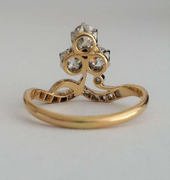 Antique Edwardian Old Cut Diamond Trefoil Cluster Ring; 'Duchesse' ring, with three old cut diamonds, 0.20cts each, rose-cut diamond accents