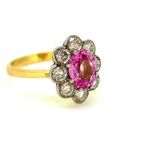 1.50ct Pink Sapphire and Diamond Floral Cluster Engagement Ring, oval pink sapphire surrounded by 1ct sparkling diamonds in timeless flower cluster design in 18ct yellow gold