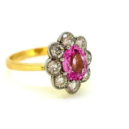 1.50ct Pink Sapphire and Diamond Floral Cluster Engagement Ring, oval pink sapphire surrounded by 1ct sparkling diamonds in timeless flower cluster design in 18ct yellow gold