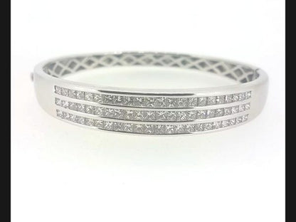 Princess Cut Diamond Bangle; Triple row of  princess cut diamonds channel set into solid 18ct white gold hinged bangle. Diamond total weight: 4.80 carats