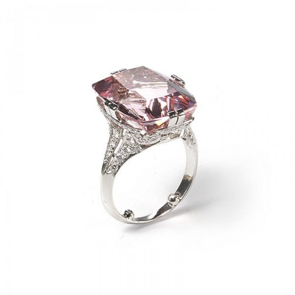 Art Deco Style Pink Kunzite, Diamond and Platinum Dress Ring; featuring a modern 16.50 carat cushion-cut pink kunzite accented by round brilliant-cut diamonds set gallery and shoulders totalling 2.00 carats