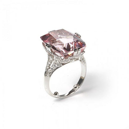 Art Deco Style Pink Kunzite, Diamond and Platinum Dress Ring; featuring a modern 16.50 carat cushion-cut pink kunzite accented by round brilliant-cut diamonds set gallery and shoulders totalling 2.00 carats