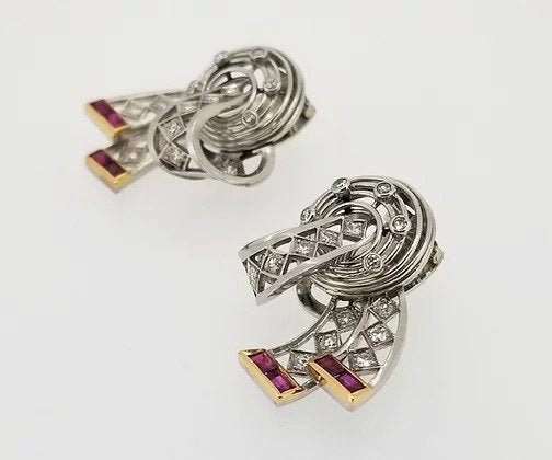 Vintage Diamond, Platinum and Ruby Clip On Earrings, openwork bow design, set with diamonds throughout and accented with rubies. Circa 1940.