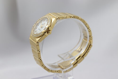 Omega Constellation Double Eagle 18ct Yellow Gold Ladies 25mm Quartz Watch, 11897500, diamond bezel and hour markers, mother of pearl dial, 18ct Gold bracelet strap with a double-fold hidden clasp, original Omega box and papers.