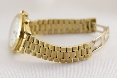 Omega Speedmaster Triple Date Moon Chronograph 18ct Yellow Gold 39mm Watch, white dial, chronograph function, weekday, month, date, moon-phase indicators, sapphire crystal, on an 18ct Yellow Gold bracelet with matching fold-over clasp, with an Omega box.