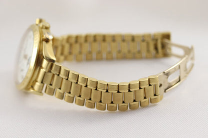 Omega Speedmaster Triple Date Moon Chronograph 18ct Yellow Gold 39mm Watch, white dial, chronograph function, weekday, month, date, moon-phase indicators, sapphire crystal, on an 18ct Yellow Gold bracelet with matching fold-over clasp, with an Omega box.