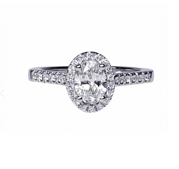 Diamond Oval Cluster Engagement Ring; GIA certified 0.50 carat F colour SI1 clarity oval faceted with diamond surround and diamond-set shoulders, in Platinum