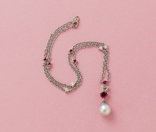 Light Grey Tahiti Pearl, Trilliant Ruby and Trilliant Diamond Pendant on a Ruby and Diamond decorated 18ct White Gold Chain