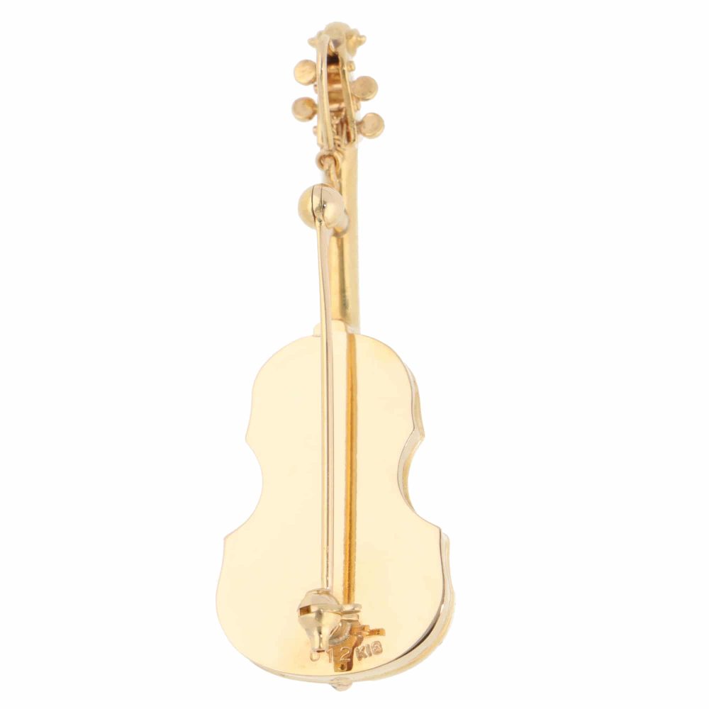 Diamond violin brooch in yellow gold.