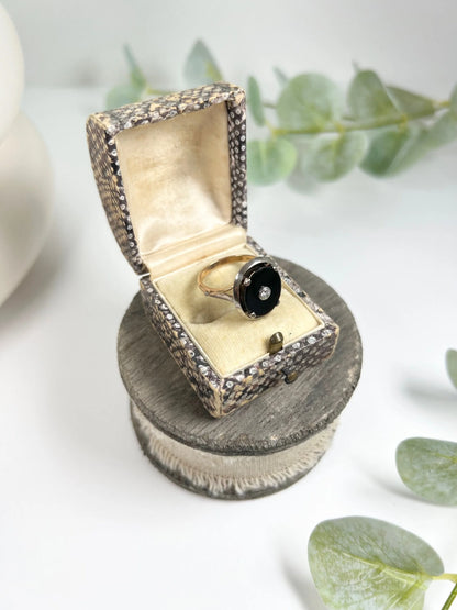 Art Deco 18 Carat Two Colour Gold Oval Onyx and Diamond Halo Ring, Circa 1920