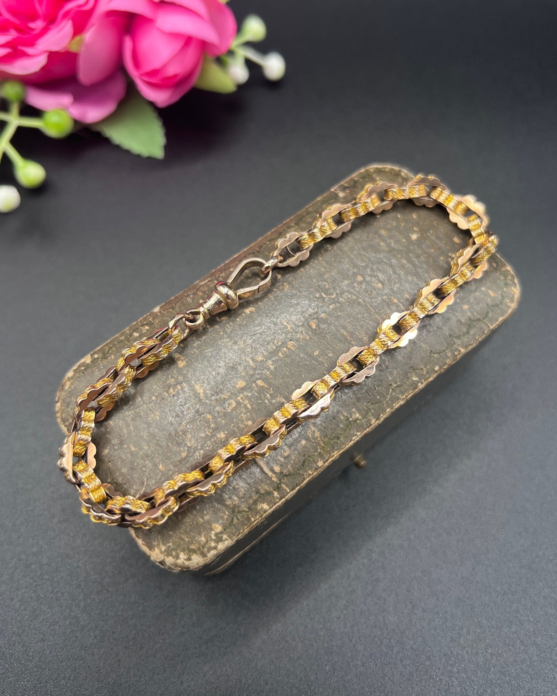 A fancy link yellow gold bracelet with a lobster claw clasp