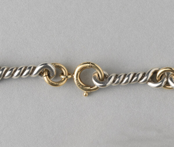 Chaumet Vintage 18ct Yellow Gold and Silver Chain; gold round links alternated with twisted silver links. Signed and numbered, Circa 1970