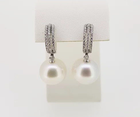 Pearl and Diamond Drop Earrings; featuring 14mm pearls suspended from diamond set hoops, 0.60 carat total, mounted in 18ct white gold.