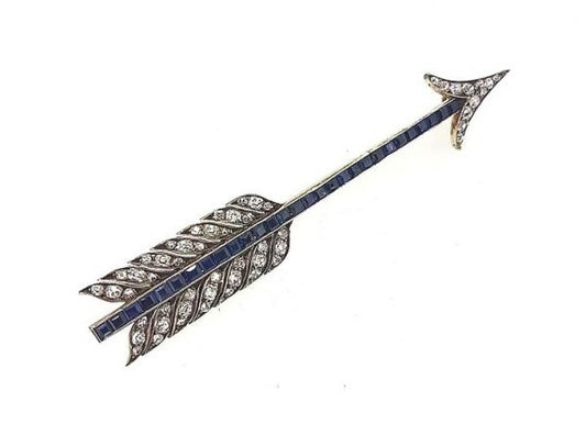 Vintage Sapphire and Diamond Set Arrow Brooch; The main body set with calibre-cut sapphires, diamond set arrow head and feathers, crafted in 18ct white gold