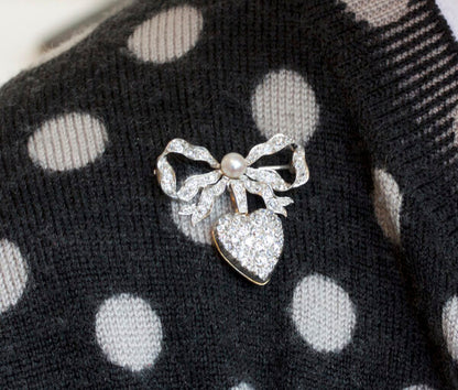 Antique Edwardian Diamond and Pearl Bow and Heart Locket Brooch; set with 1.08cts old-cut diamonds and a natural pearl, platinum and 18ct gold