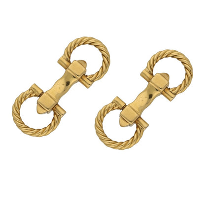 A pair of yellow gold rope design cufflinks on a white background