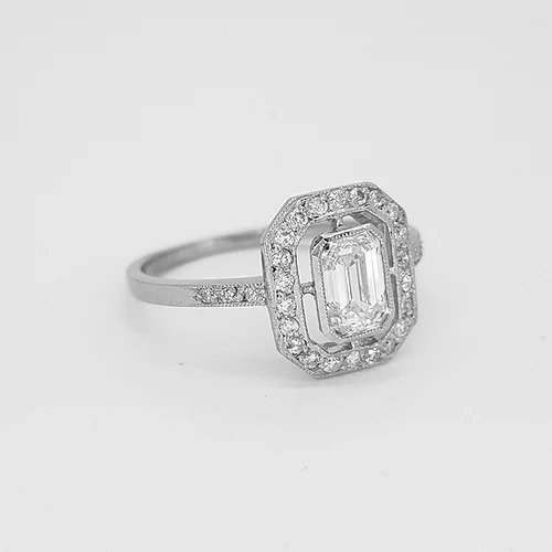 Emerald Cut Diamond Cluster Ring in 18ct White Gold; central 0.75ct emerald-cut diamond surrounded by 0.25ct diamond border and diamond set shoulders, 1.00 carat total