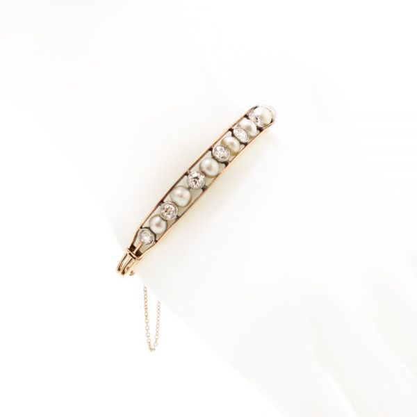Antique Edwardian Natural Pearl and Old Cut Diamond Bangle Bracelet; set with natural saltwater pearls and 2.75cts old cut diamonds, in 15ct gold and platinum, with GCS certificate