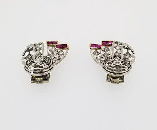 Vintage Diamond, Platinum and Ruby Clip On Earrings, openwork bow design, set with diamonds throughout and accented with rubies. Circa 1940.