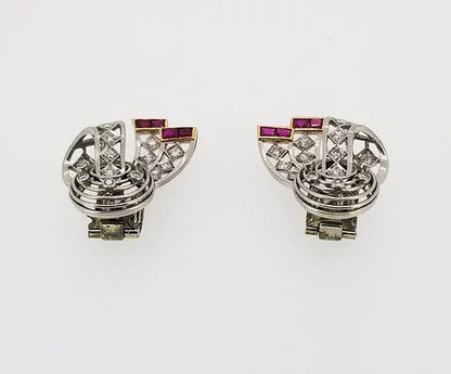 Vintage Diamond, Platinum and Ruby Clip On Earrings, openwork bow design, set with diamonds throughout and accented with rubies. Circa 1940.