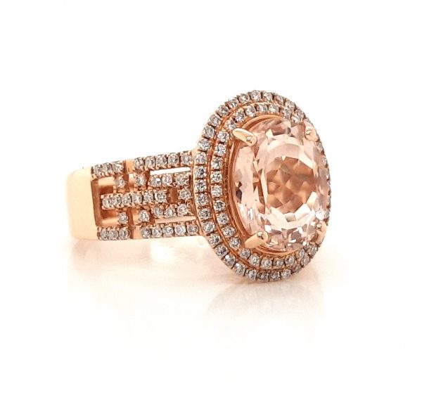 2.54ct Oval Morganite and Diamond Cluster Dress Ring in 18ct Rose Gold; central 2.54 carat oval faceted morganite accented with a double diamond surround and diamond set geometric pierced shoulders