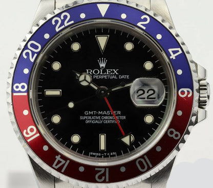 Rolex GMT Master 16700 Stainless Steel 40mm Automatic Watch, black dial, Pepsi red and blue rotating bezel, 24 hour hand, date indicator and sapphire crystal. Stainless steel Oyster bracelet. With Rolex box and papers. Purchased in 1996.