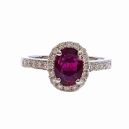 Burma Ruby and Diamond Cluster Ring; central 1.11ct oval faceted Burmese ruby with no indication of heat treatment set within a diamond halo, with diamond set shoulders, in 18ct white gold